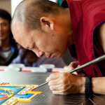 Tibetan monks making sand mandala