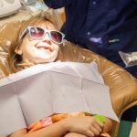 Young girl in dentist chair