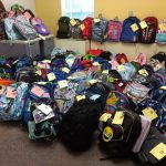 big pile of backpacks