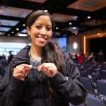 Vanessa Neal holding her Presidential Coin