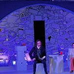 two actors rehearsing a scene onstage