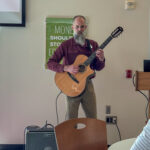 Zach with guitar and amplifier