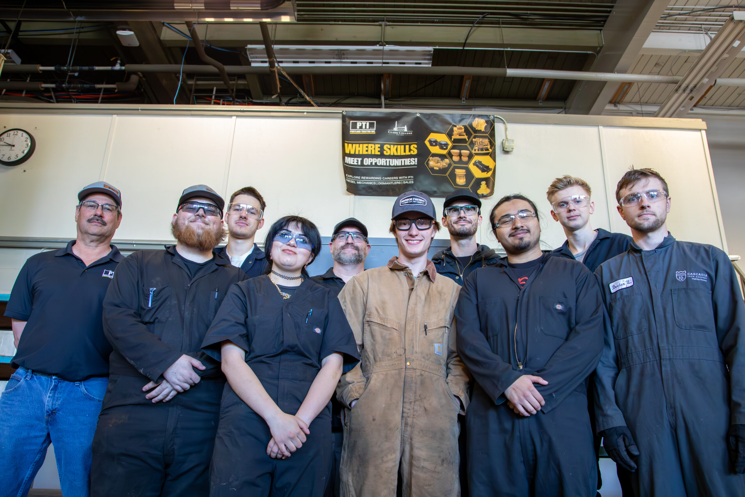 large group of people with protective eye gear and work wear.